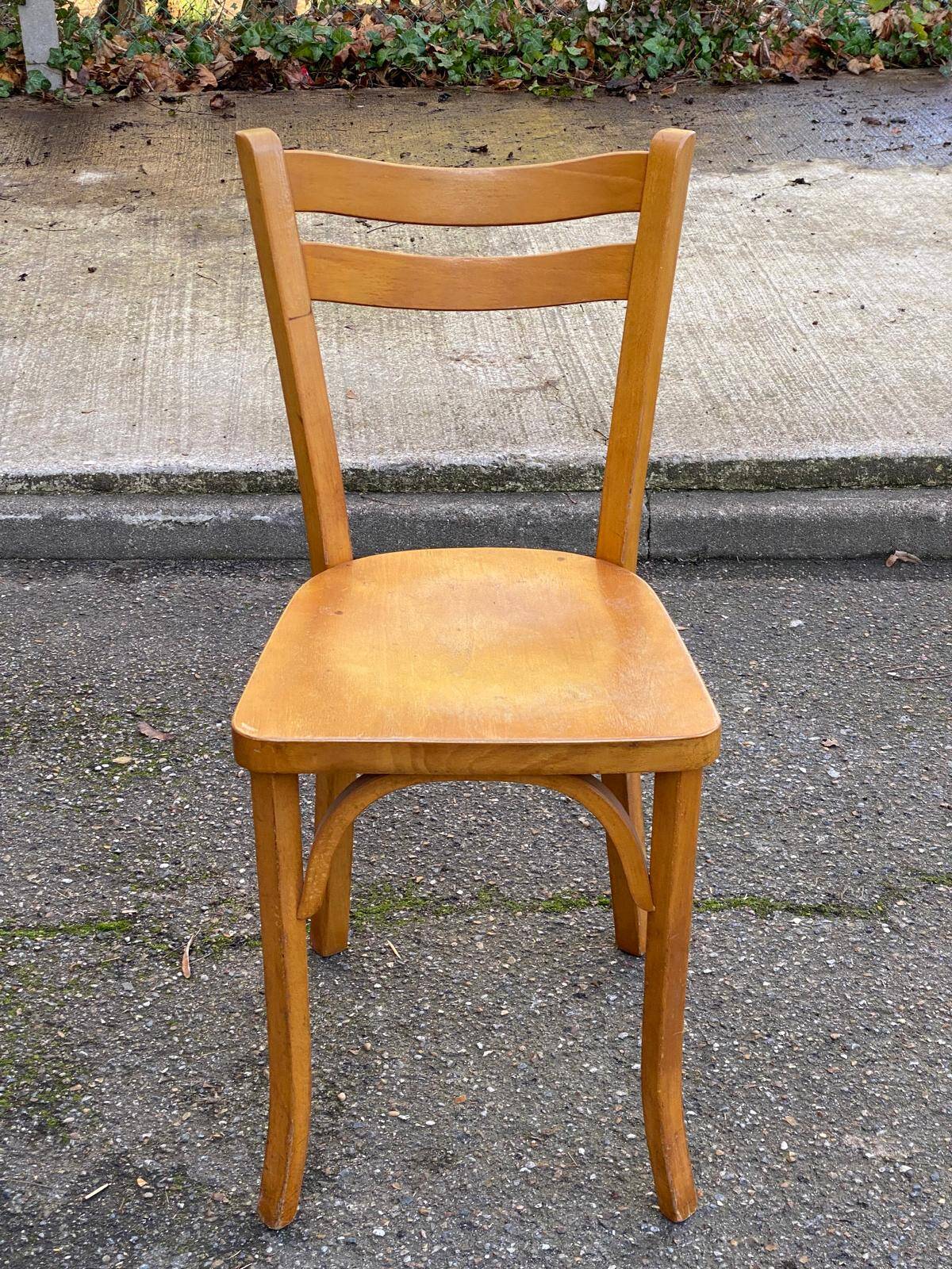 2 Scandinavian bistro chairs by Baumann in light wood from 1980.