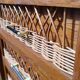 Commode haute bois et rotin pieds compas