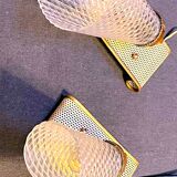 Pair of brass sconces, perforated metal and perhapx conical lampshade, France 50's