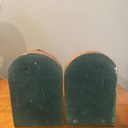 Pair of bronze bookends with masks