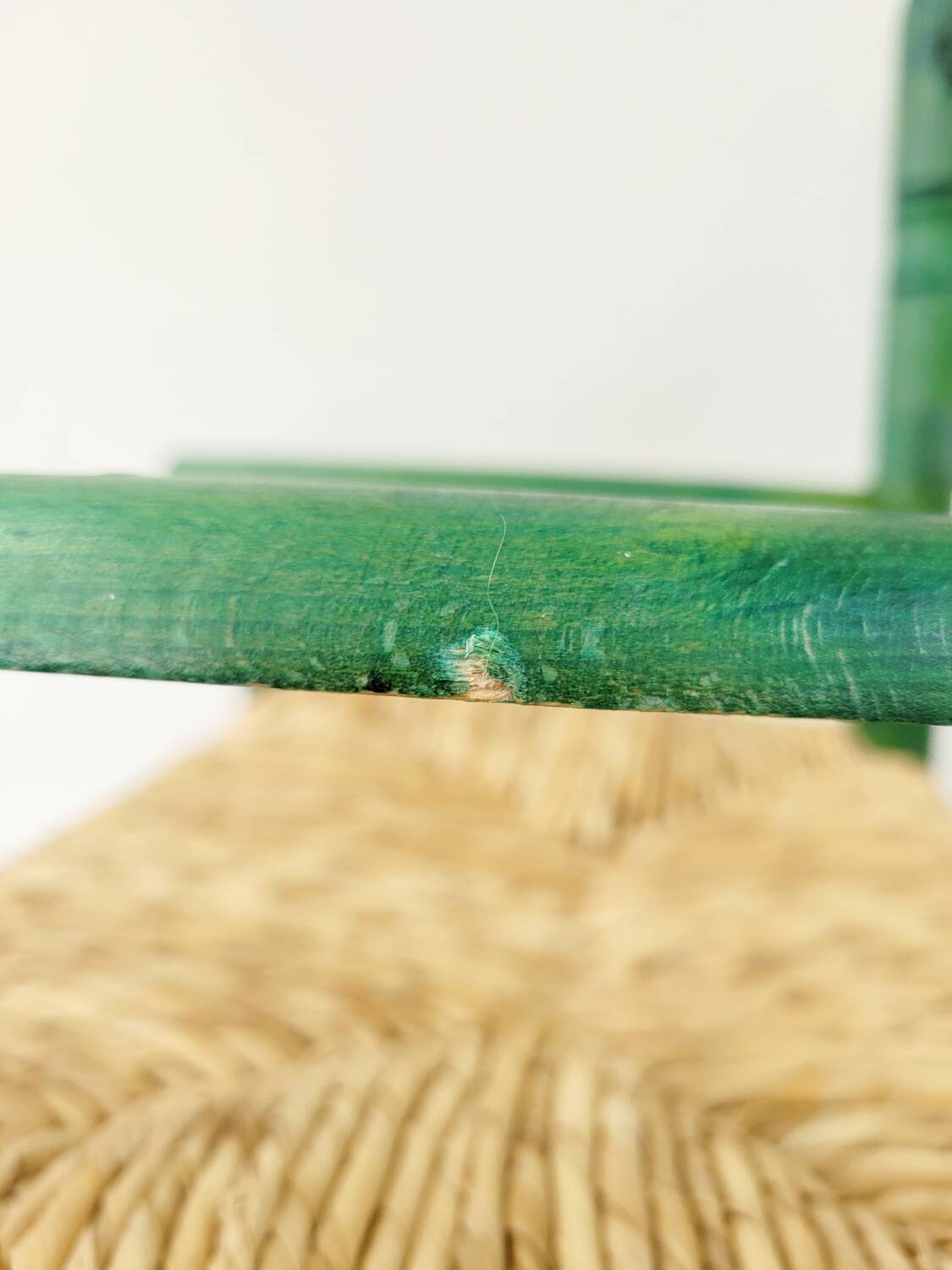 Small vintage children's chair in wood and green straw