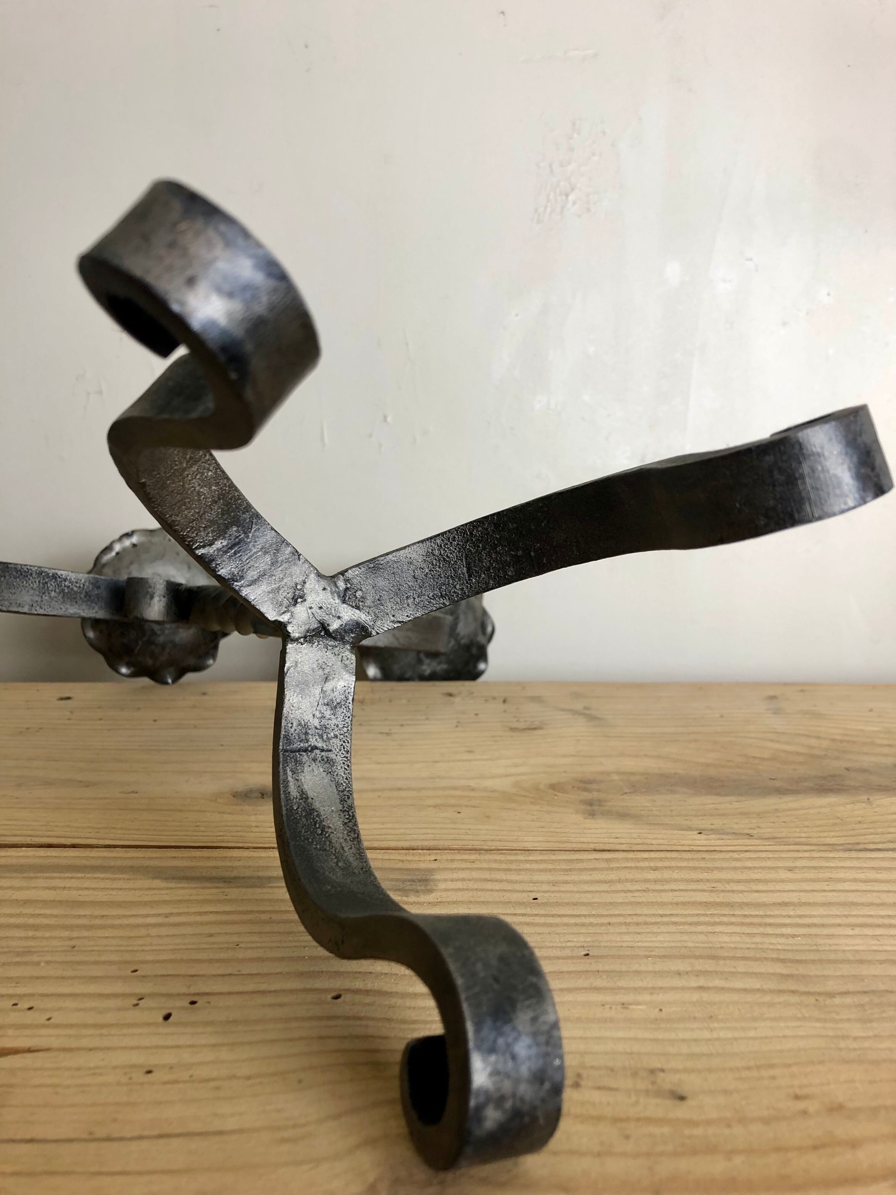 Pair of wrought iron candlesticks