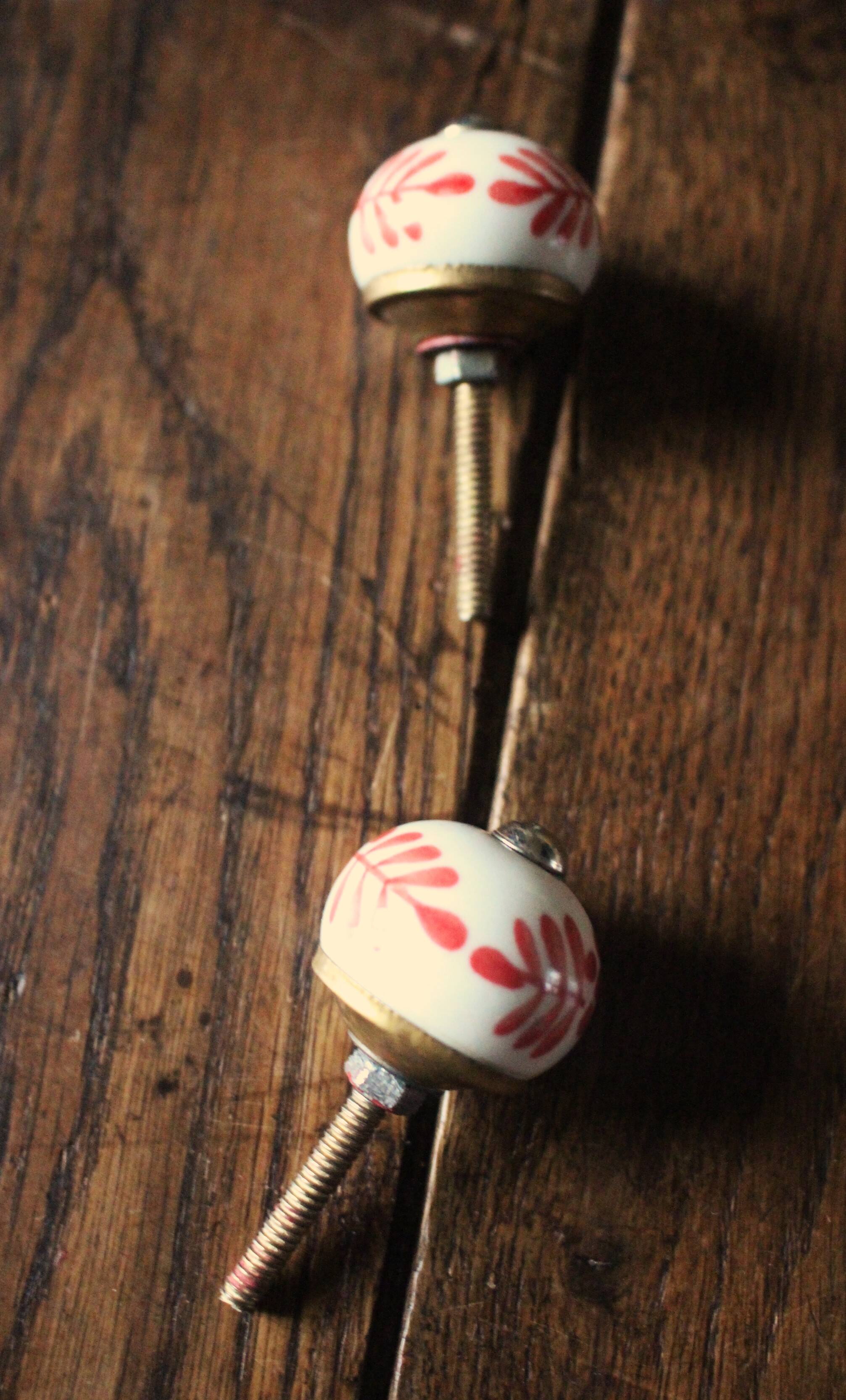 Pair of white and red porcelain drawer cupboard door knobs
