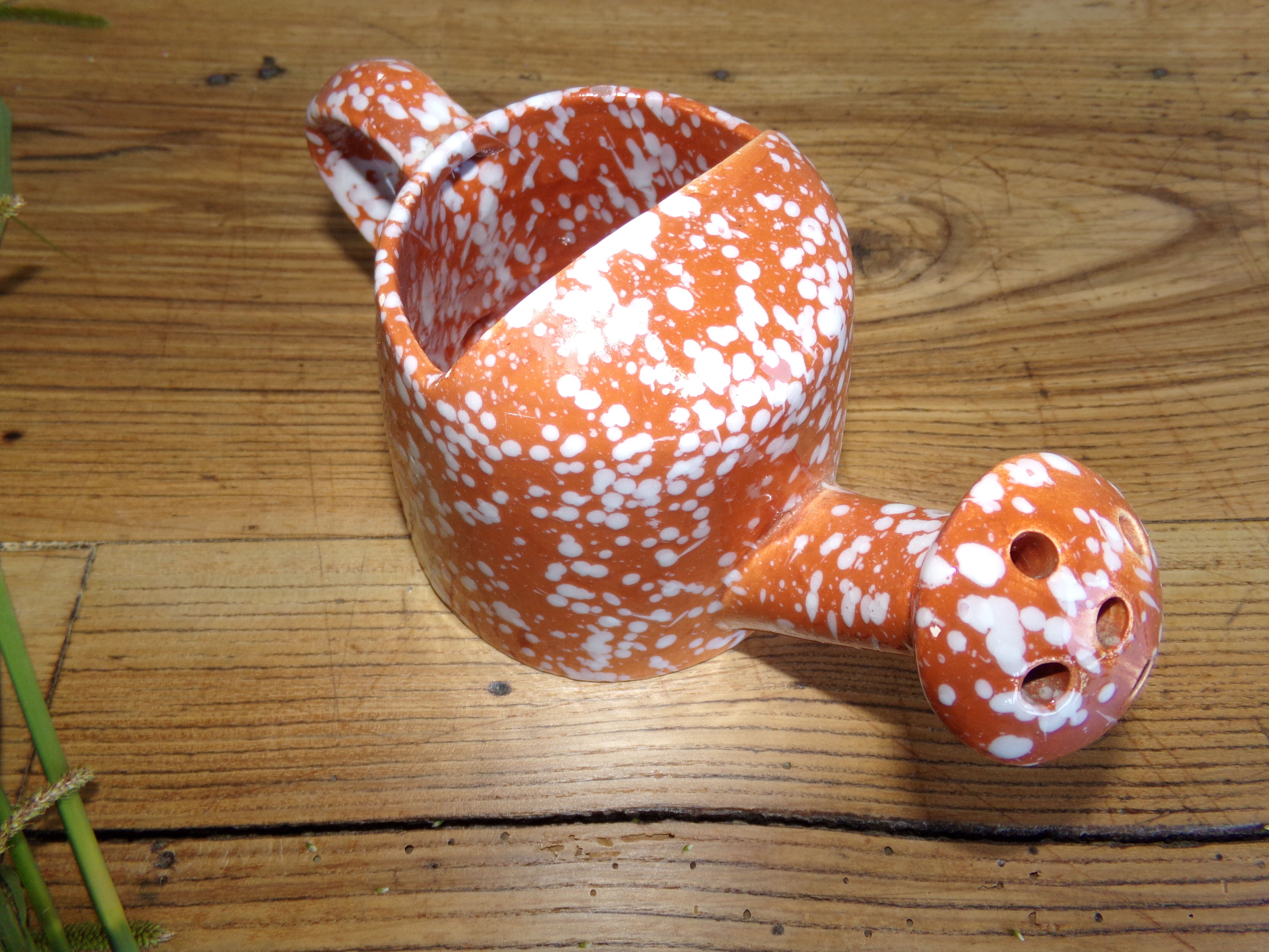 Ceramic watering can