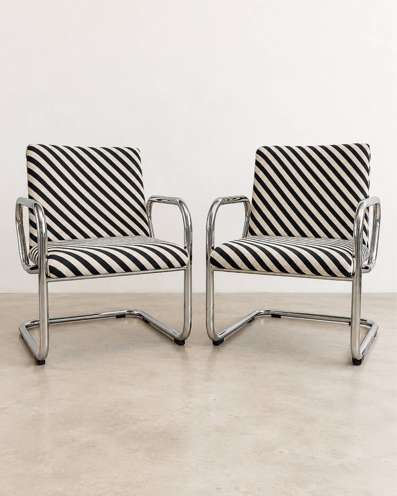 Restored vintage tubular chrome armchairs