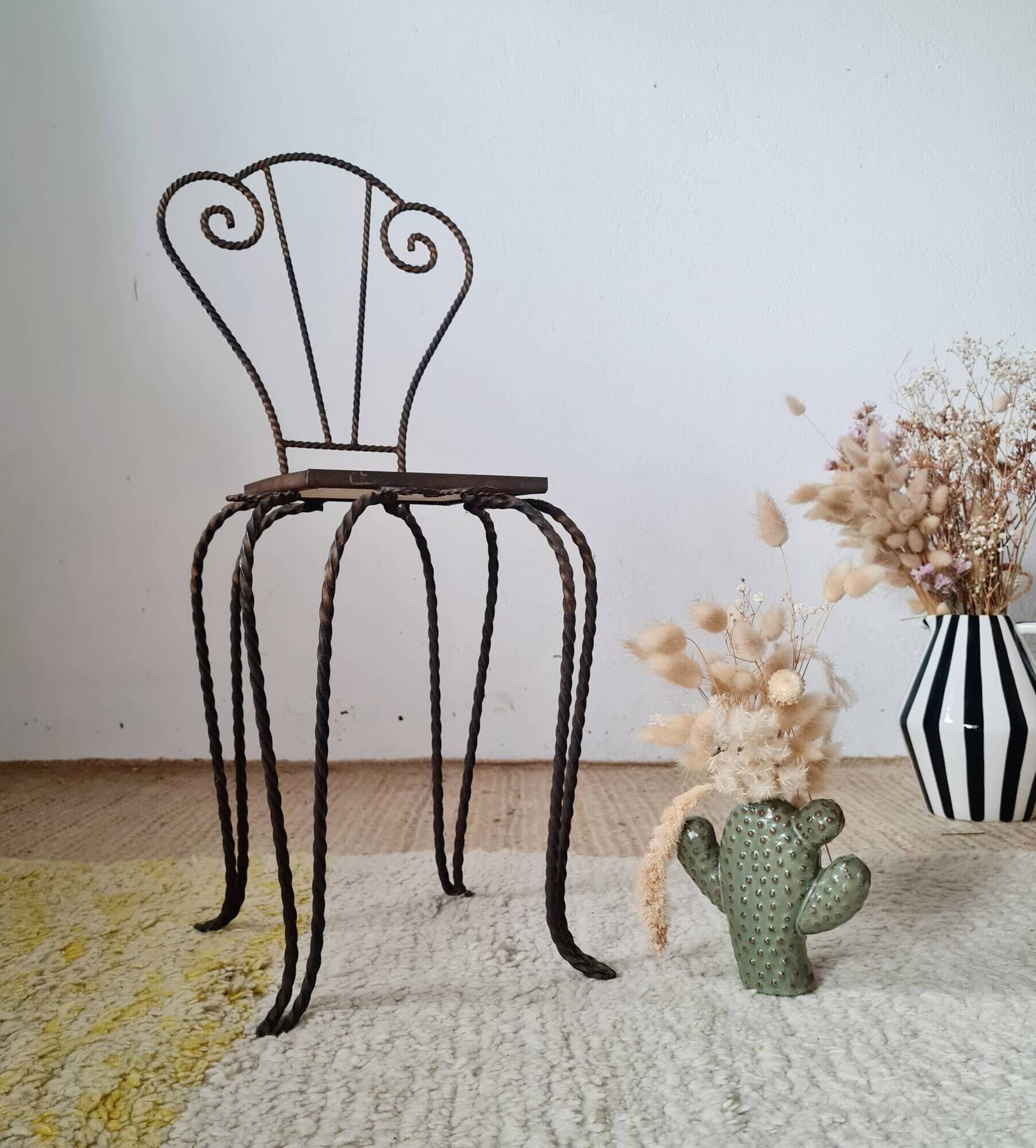 Small chair / stool in twisted wrought iron and floral ceramic.
