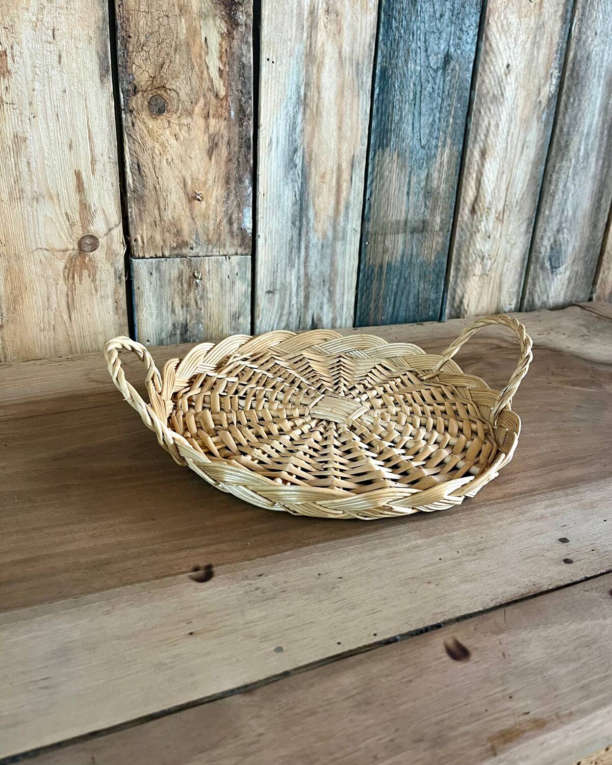 Vintage round flat rattan basket