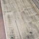 Table ancienne de métier en bois patiné, piètement vert – 105 cm
