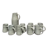 Set in stoneware cups and pitcher