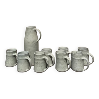 Set in stoneware cups and pitcher