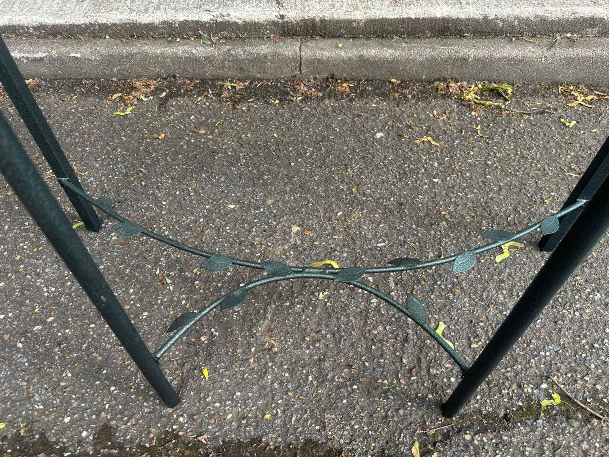 Grey-green wrought iron half-moon console with glass, 85cm.