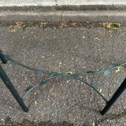 Grey-green wrought iron half-moon console with glass, 85cm.