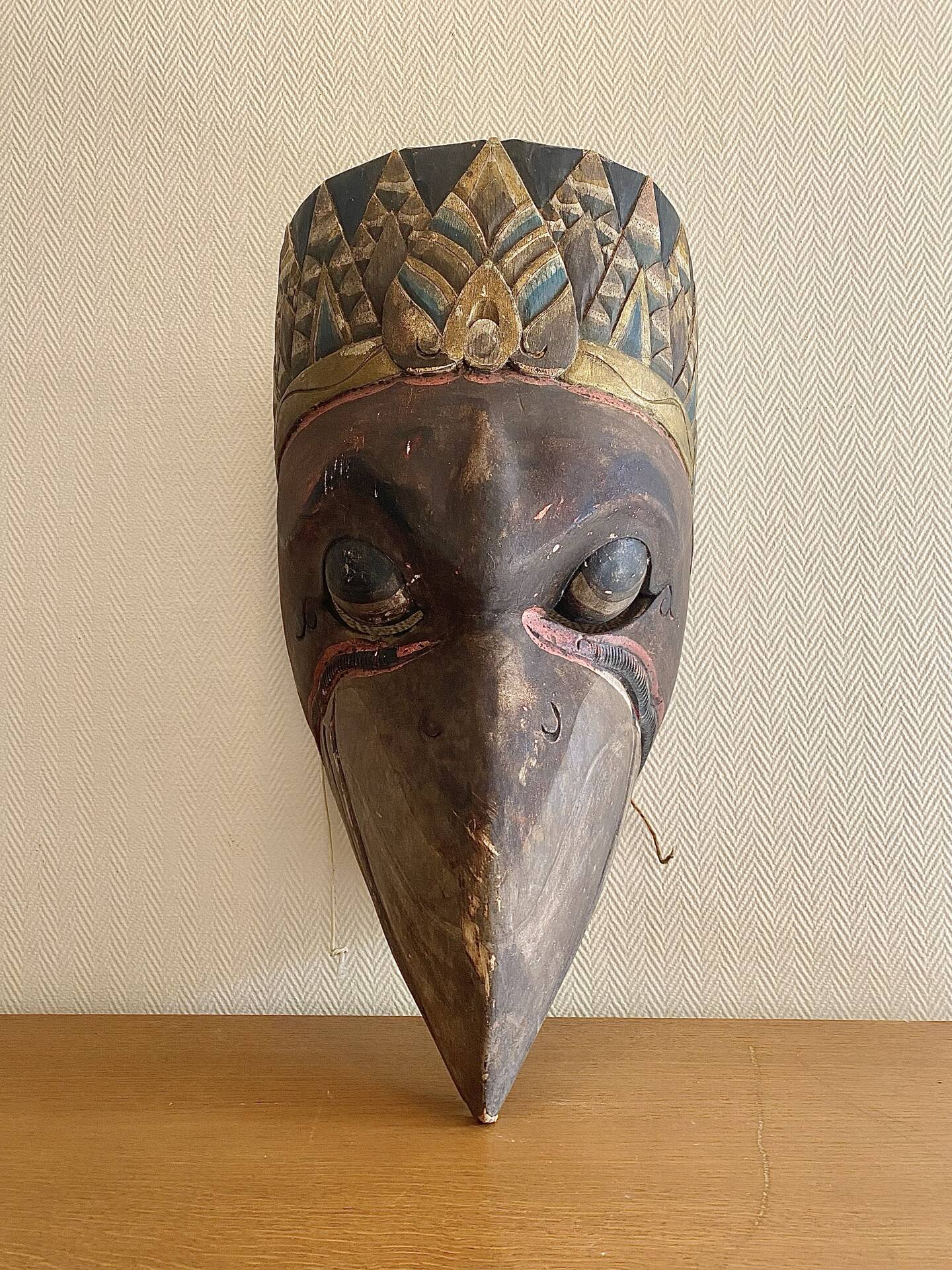 Grand traditional Indonesian mask carved from wood.