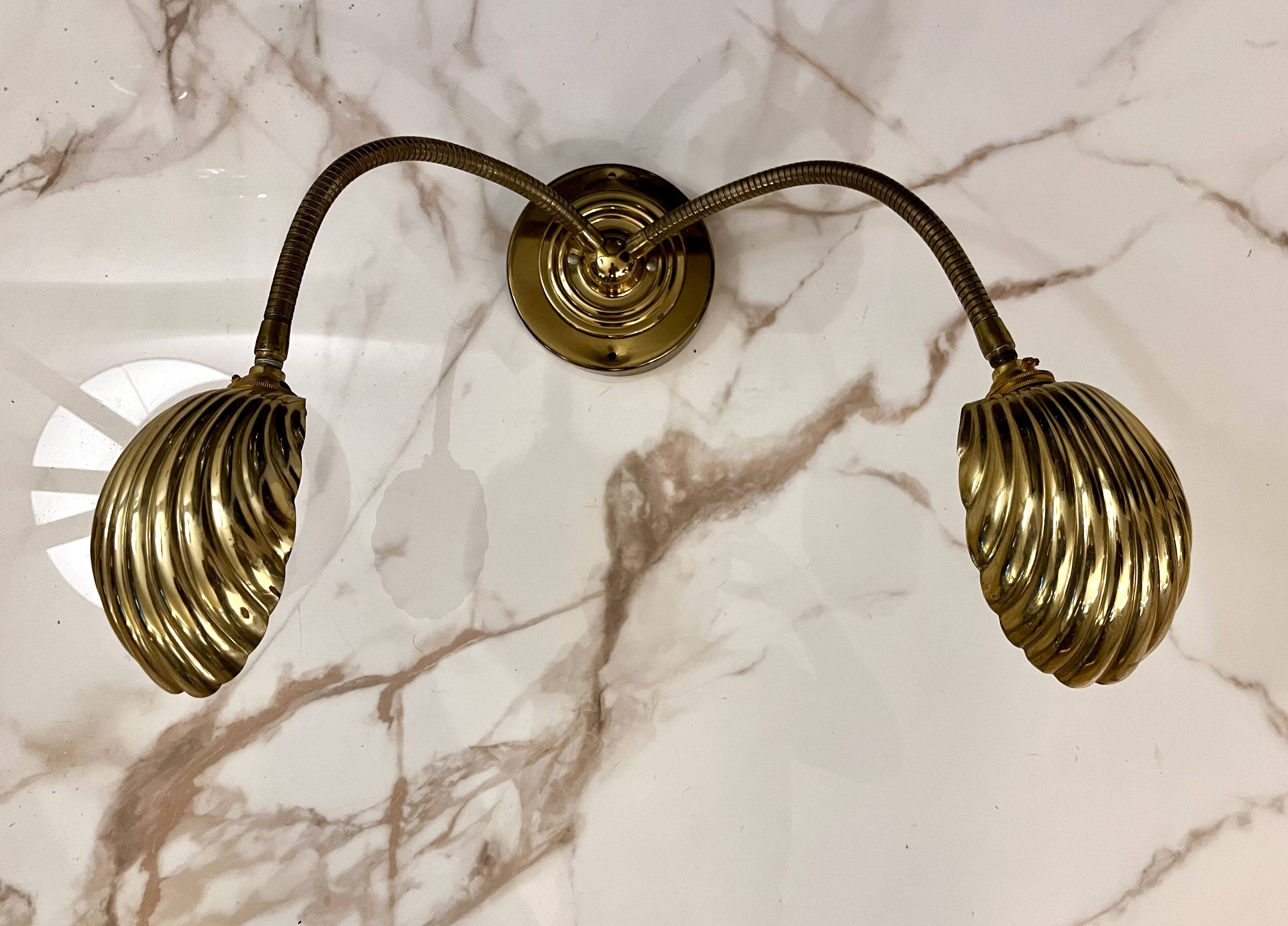 Articulated shell wall light