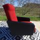 Vintage armchairs in red and black faux leather, the pair.