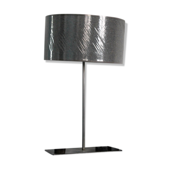 Metal lamp with metallic grey lampshade and with magnetized African wooden statuettes