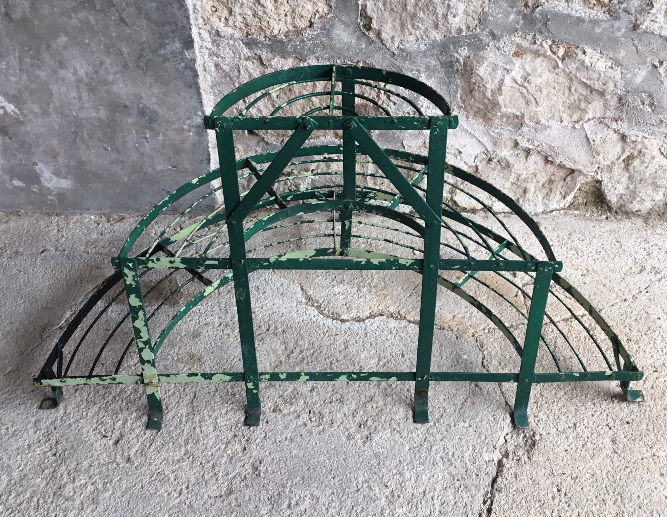 Antique half-moon metal plant stand