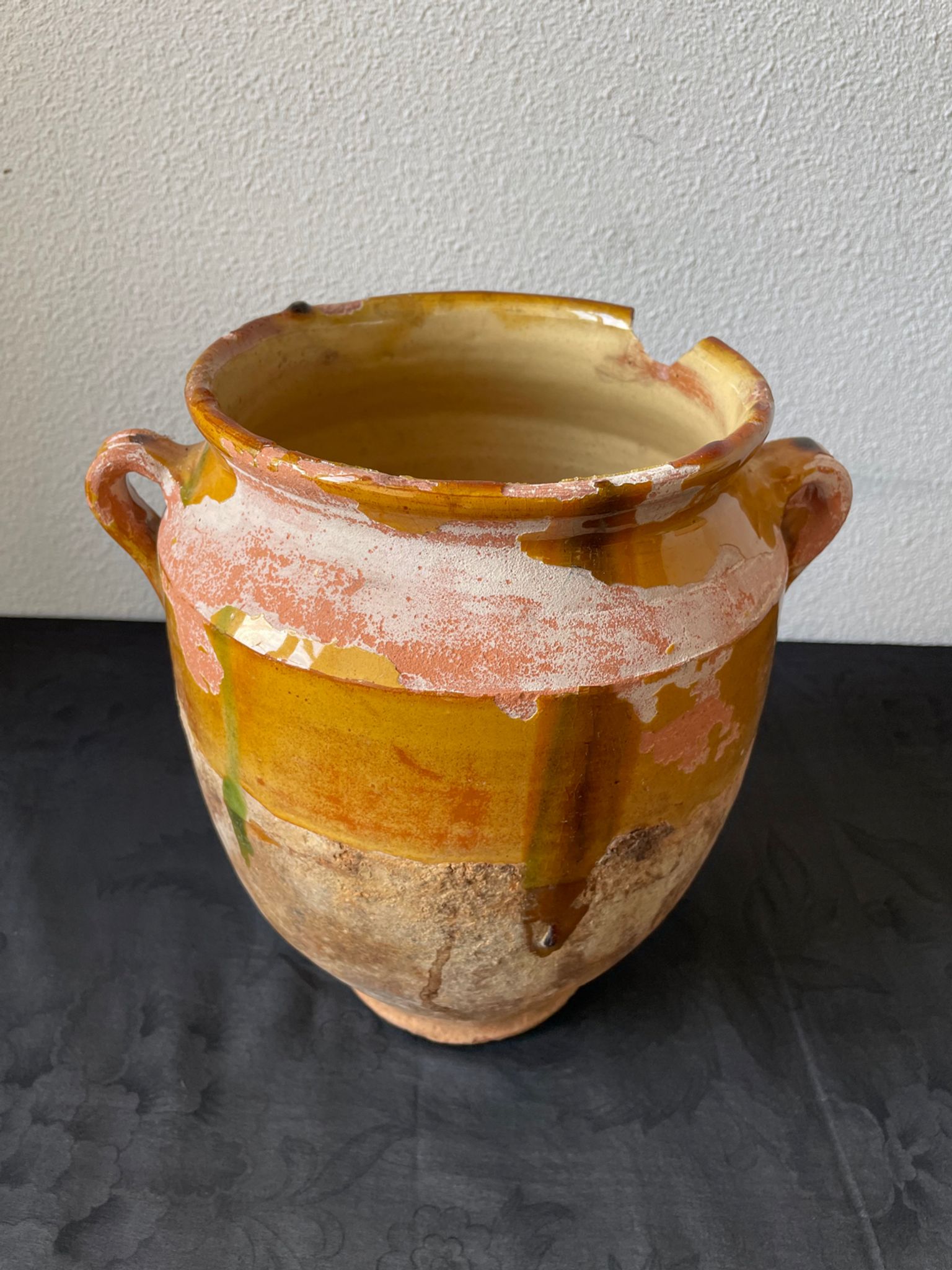 Old grease pot in glazed yellow terracotta, France nineteenth century
