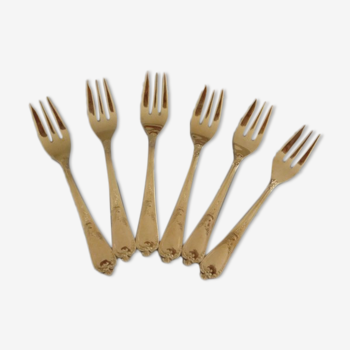 Golden metal cake forks