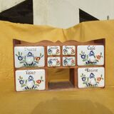 Vintage wooden spice rack with ceramic drawers