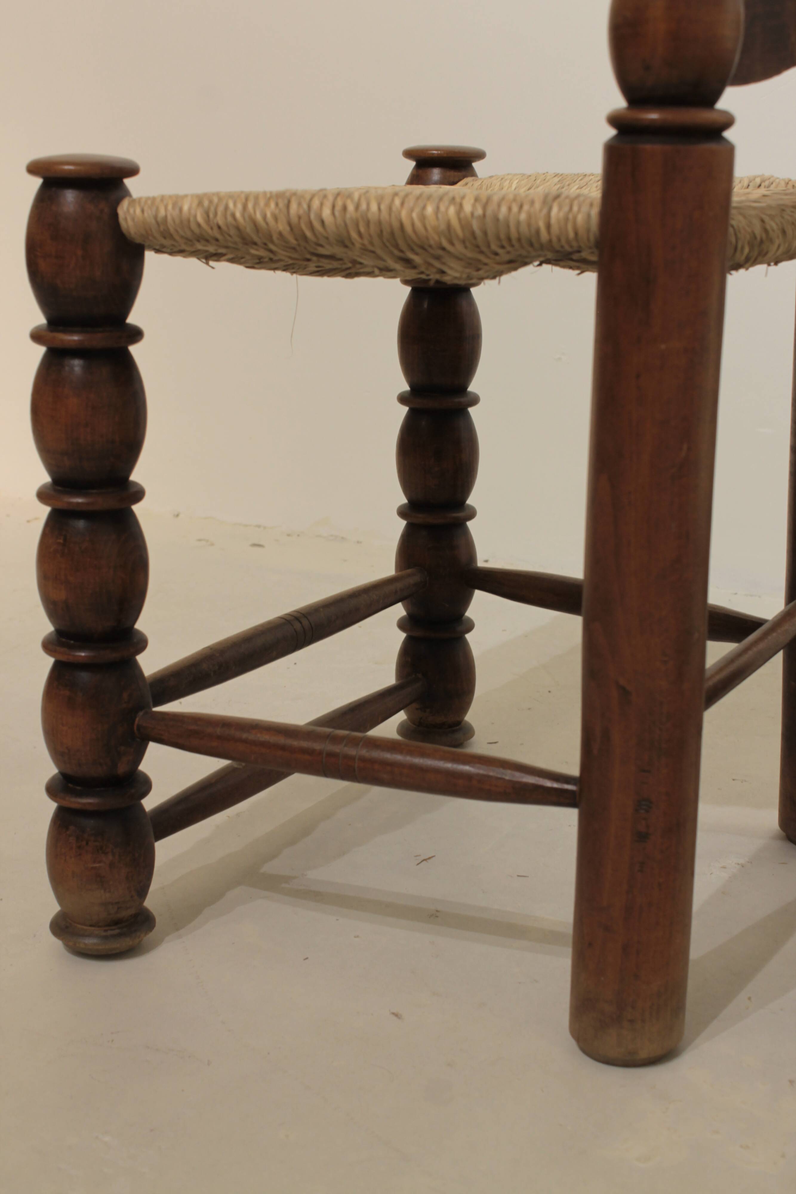 Pair of rustic chairs in turned wood with straw seats