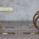 Pair of Empire style bronze wall lights, bronze wall light with palmette and swan neck.