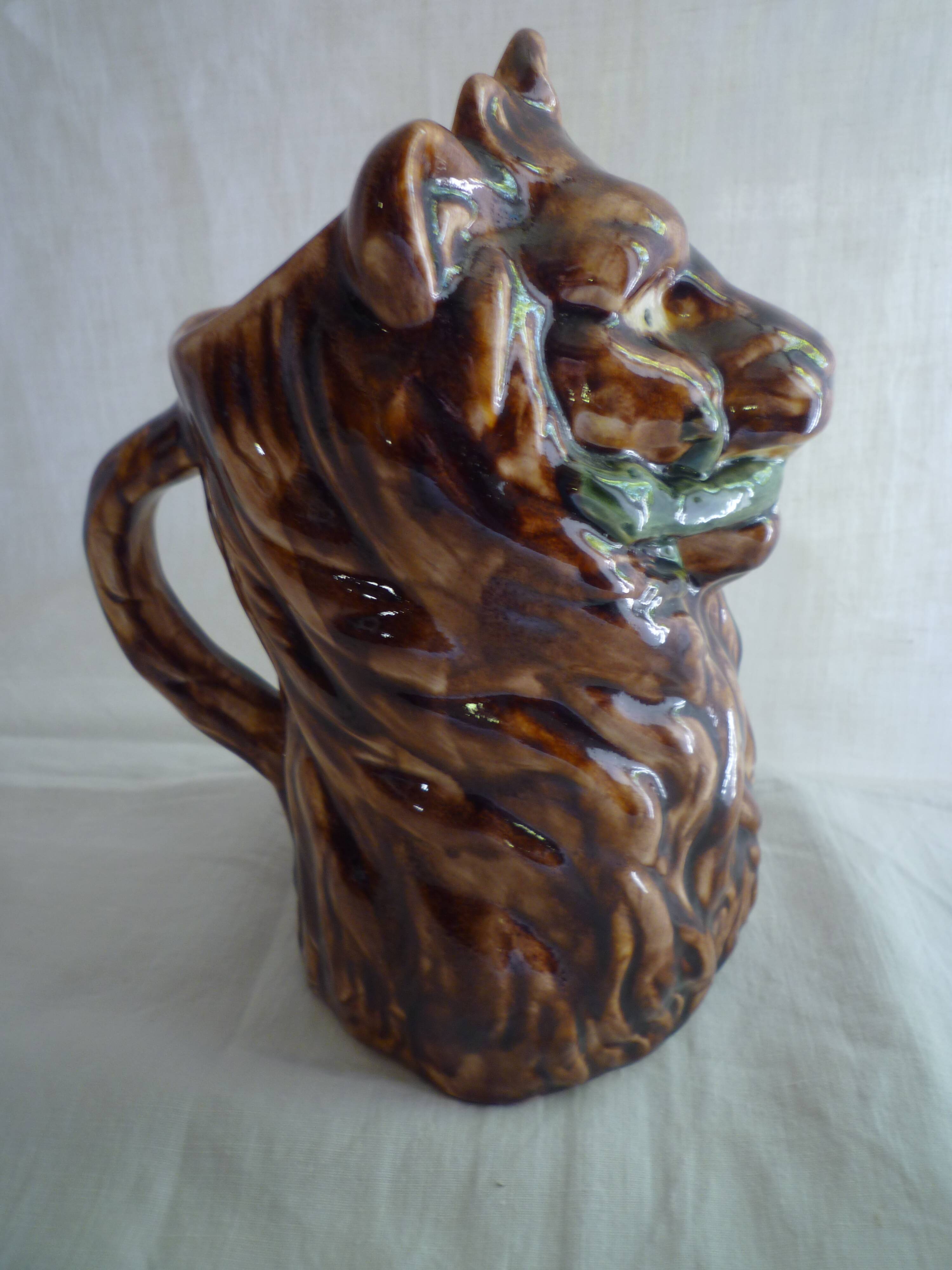 Lion head slip pitcher late 19th century