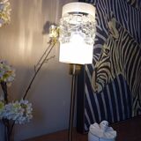 Table lamp with gold metal base and cylindrical textured glass shade