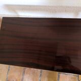 Lacquered coffee table with vintage wheels 70s