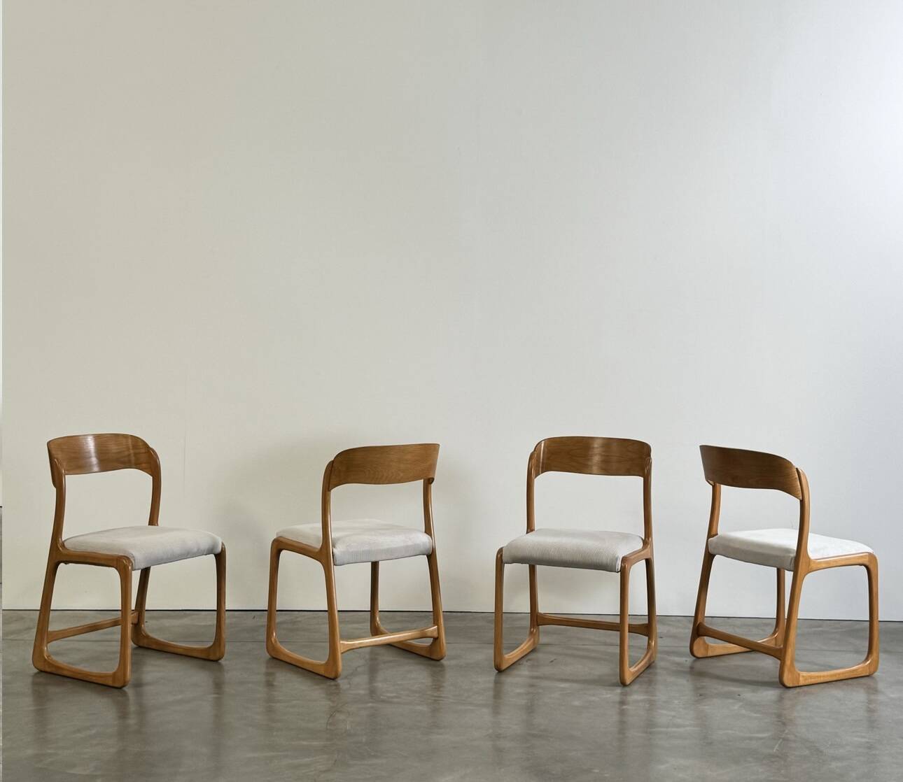 Set of 4 vintage Baumann sled chairs in ecru velvet