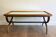 Patinated and gilded carved wooden coffee table. Hirch House.