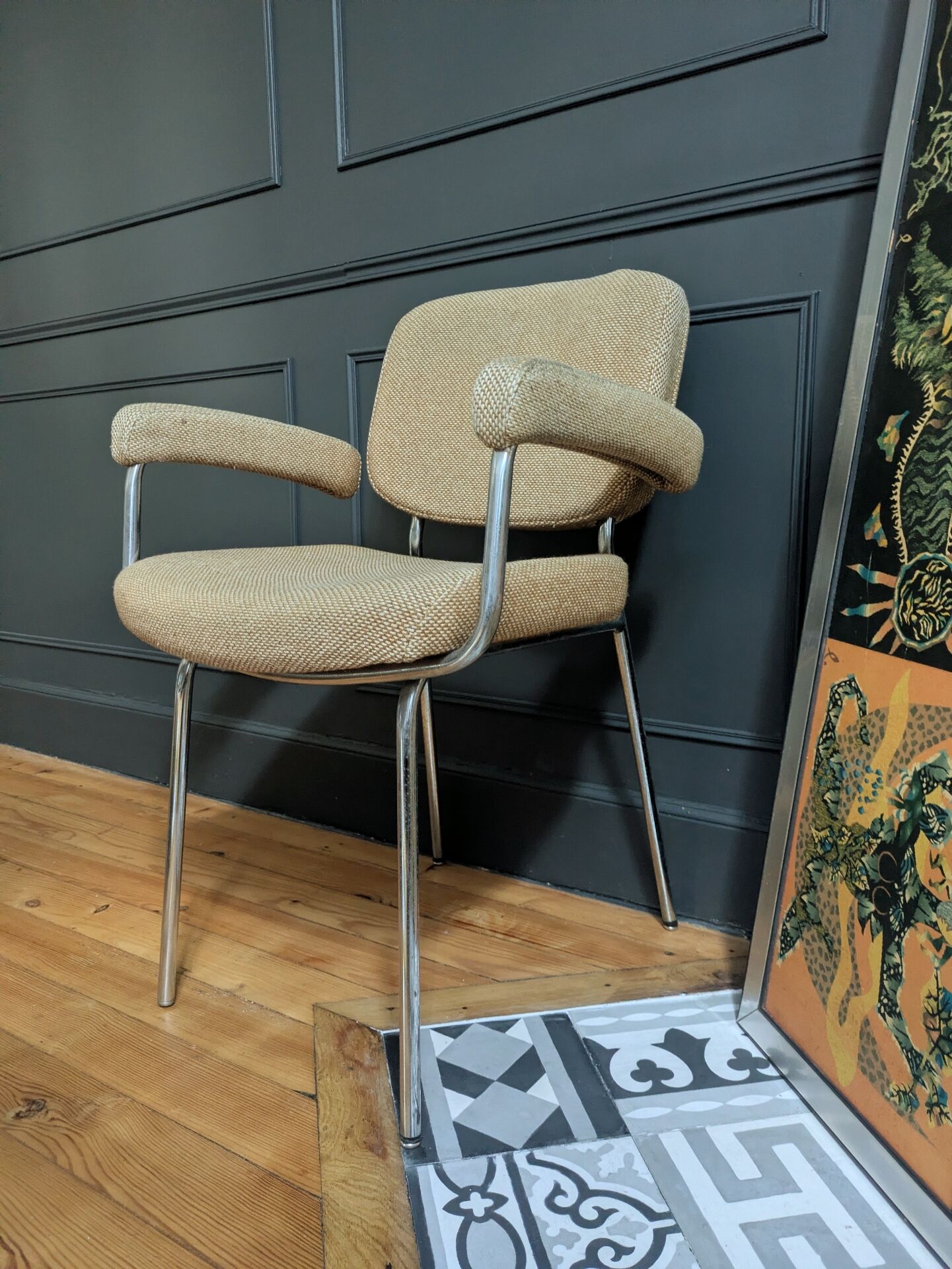 vintage tubular metal chrome office chair with patterned fabric.