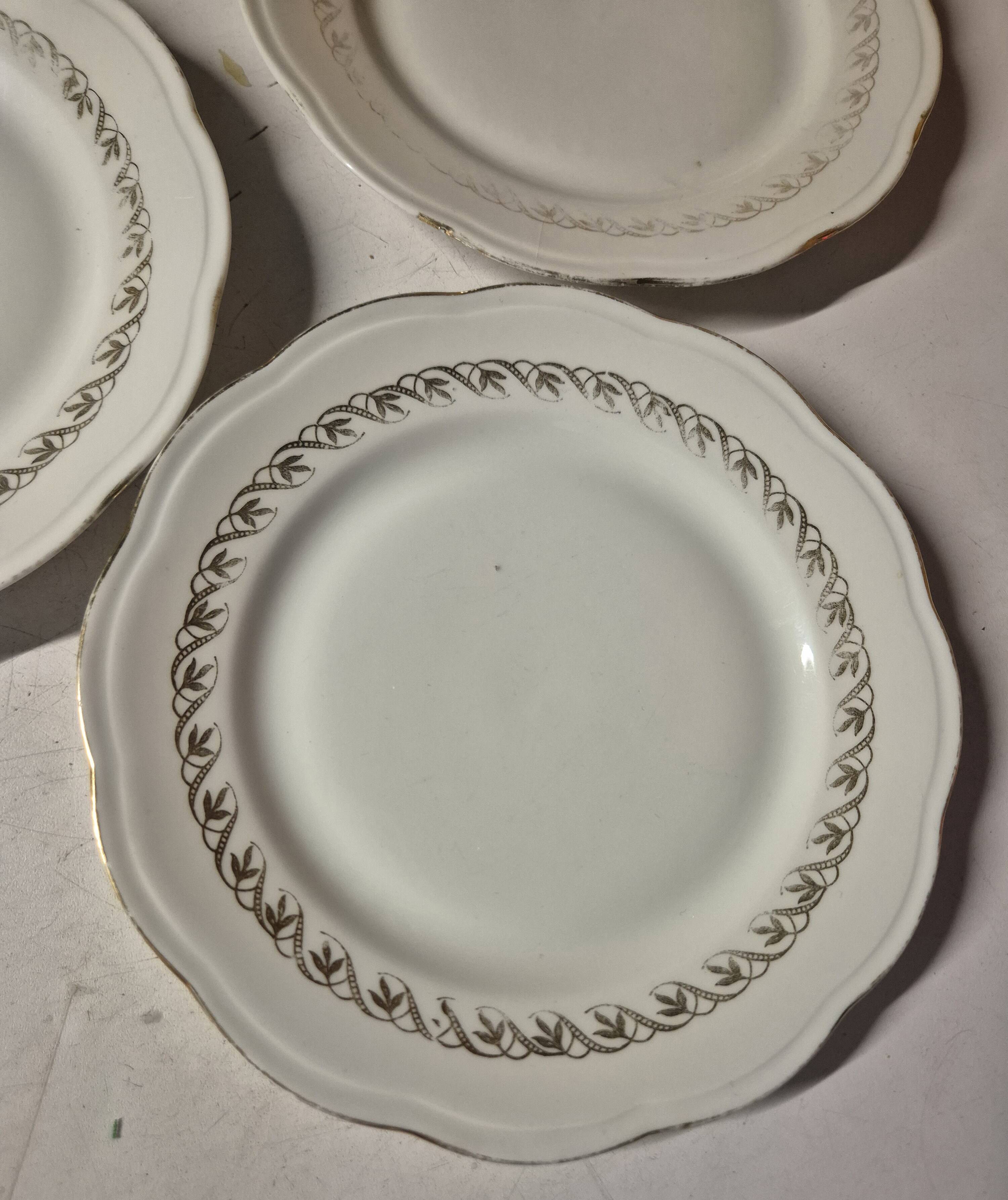 Set of 7 fine porcelain dessert plates with gilding, SFP, French company