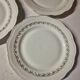 Set of 7 fine porcelain dessert plates with gilding, SFP, French company