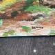 Canvas on village scene frame signed vintage Denise