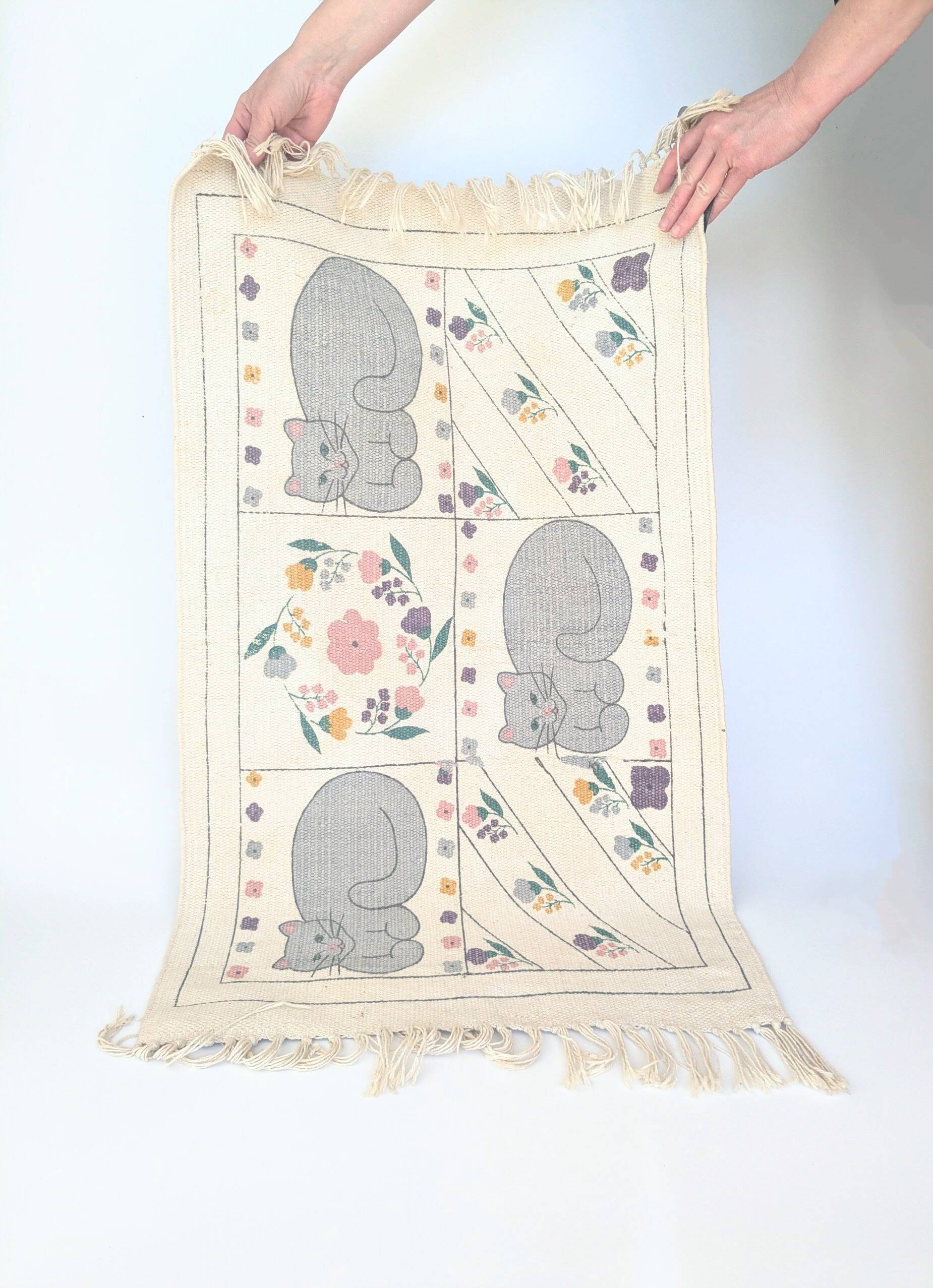 1980s handwoven cotton rug with a cat and flower pattern