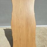 Violin-shaped coffee table with brass legs