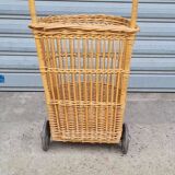Vintage wicker log basket on vintage wheels