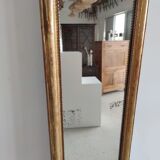 Long wooden mirror and gilded stucco with pearl rays H: 2m45 L: 40cm