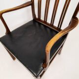 Mid-century armchair by Ole Wanscher for Fritz Hansen, stained beech and leather.