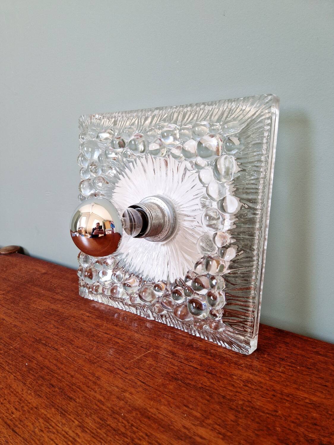 Space Age wall light in pressed transparent moulded glass, 1970.