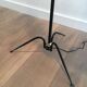 Floor lamp in black lacquered metal and brass