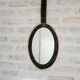 Vintage oval mirror with tartan decoration.