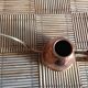 Copper and brass watering can