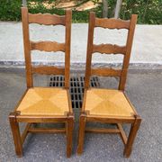 8 wooden dining chairs with straw seats, farmhouse style, high back.