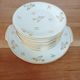 Dessert service, 10 plates and 1 pie dish, in Limoges Porcelain, white and gold