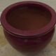 Garnet-colored terracotta flowerpot