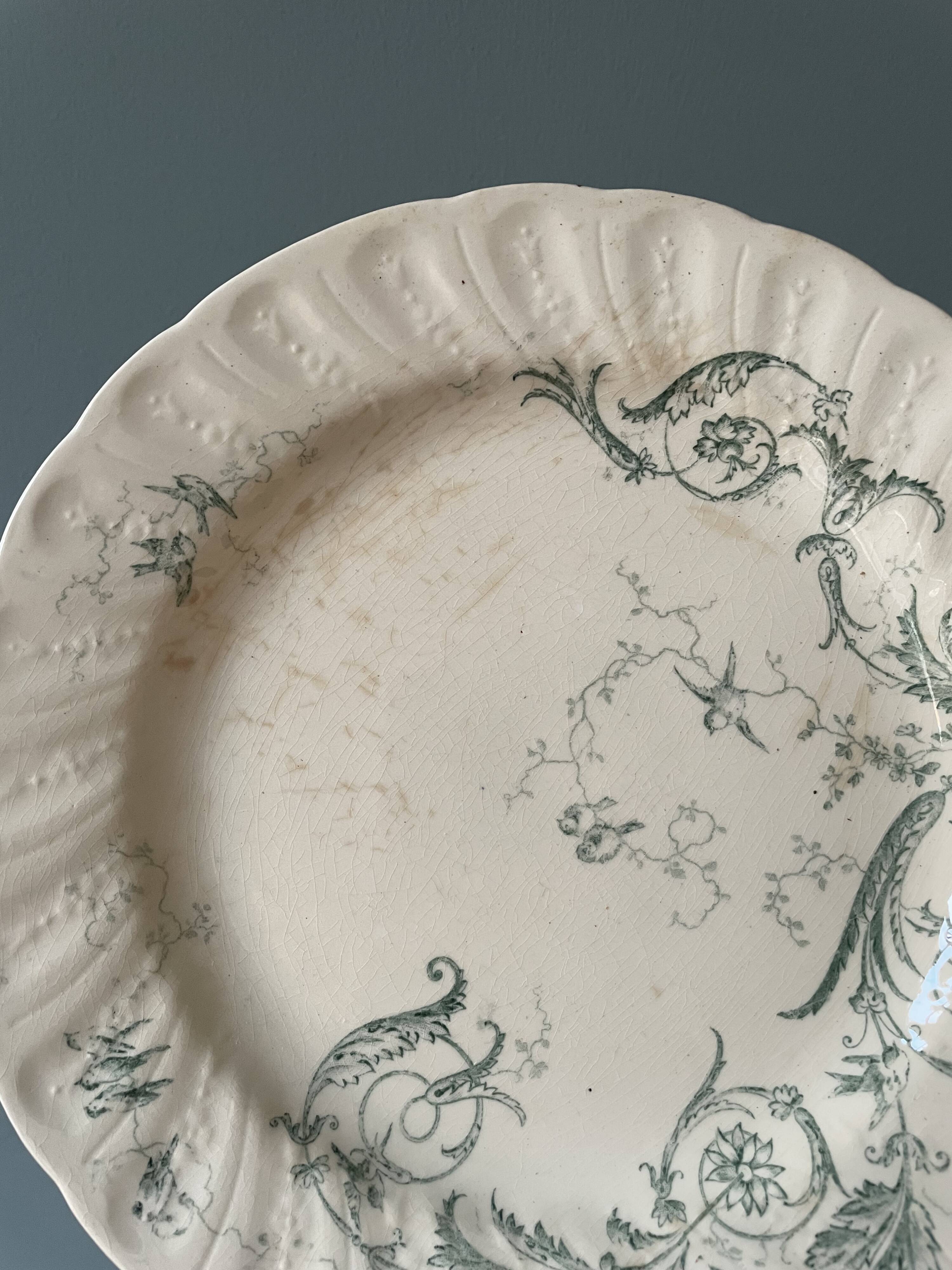 Set of 12 flat plates Terre De Fer XIXth in opaque porcelain of Gien, model Rinceaux