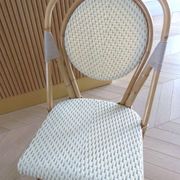 Pair of Parisian bistro chairs from Maison Louis Drucker in light Manila rattan.