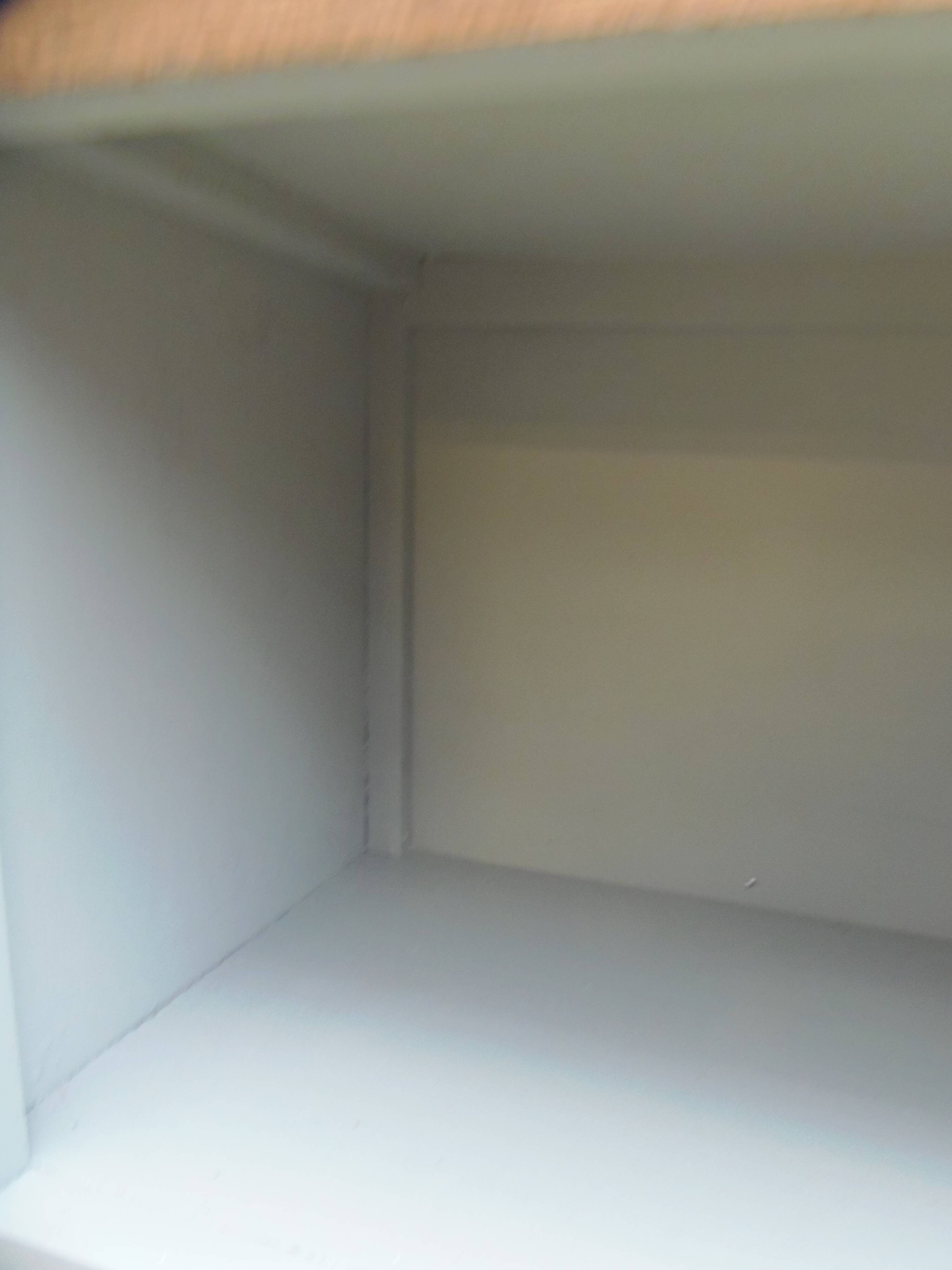 Vintage furniture of shallow depth re-enchanted in grey-green.